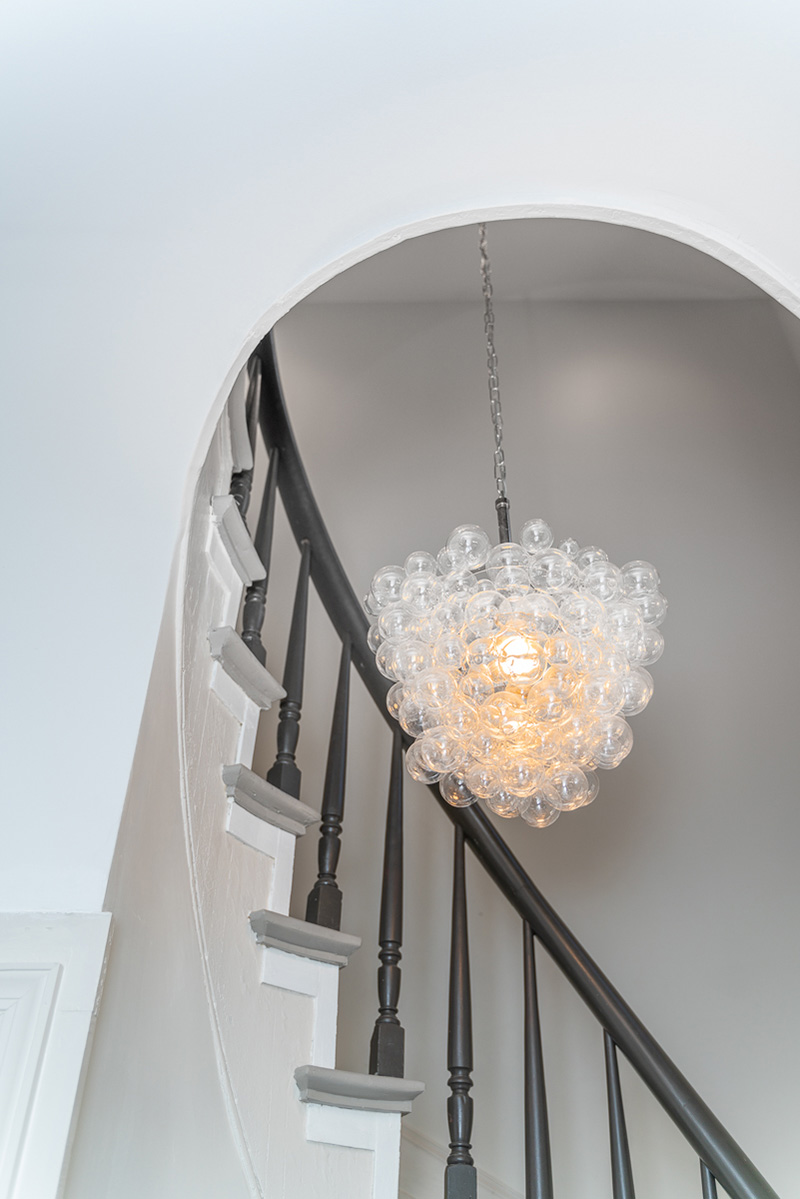 arched entry and bubble chandelier